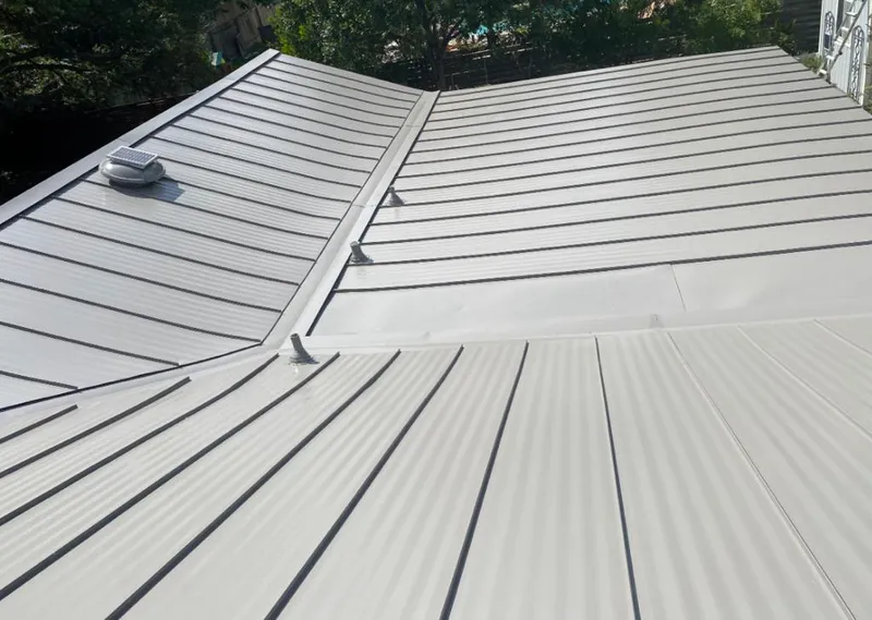 Solar attic fan installed on a metal roof for Roof Ventilation in Long Hill